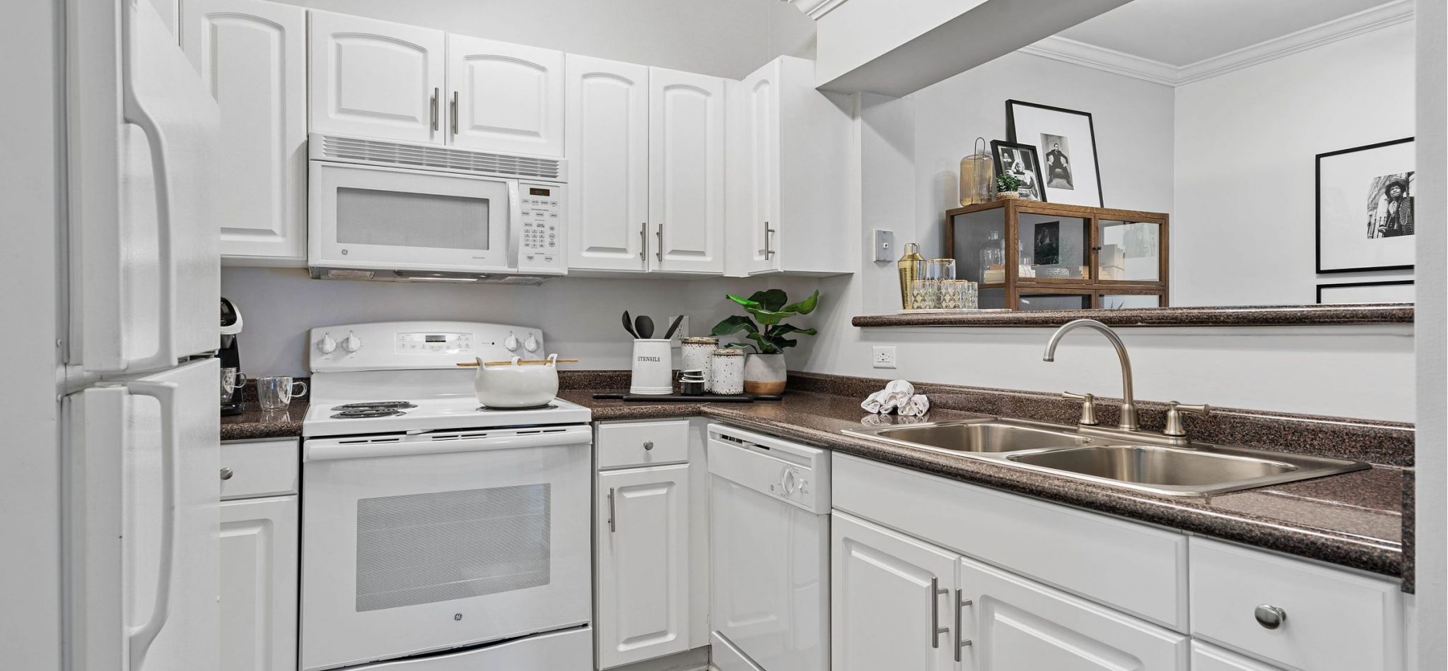 Hawthorne at the Carlyle apartment kitchen equipped with appliances and ample cabinet storage.